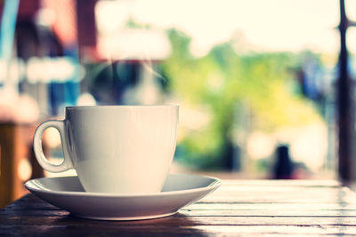 Close-up of coffee cup on table