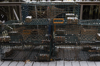 Lobster traps are stacked on a dock on the coast of maine. acadia national park