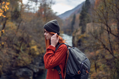 Man looking away in forest