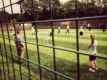 Girl playing soccer in park