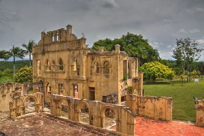 Old ruin building against cloudy sky