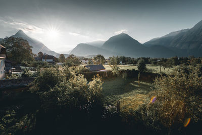 Panoramic view of buildings and mountains against sky