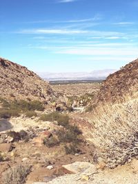 Scenic view of arid landscape against sky