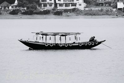 Boat sailing in sea against sky