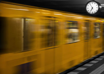 Blurred motion of train at railroad station