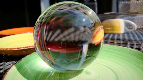 Close-up of bubbles in glass ball on table