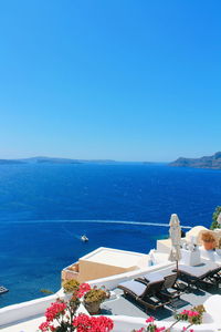 Scenic view of sea against clear blue sky