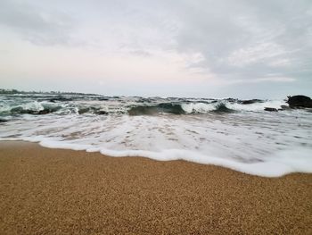 Surface level of beach against sky