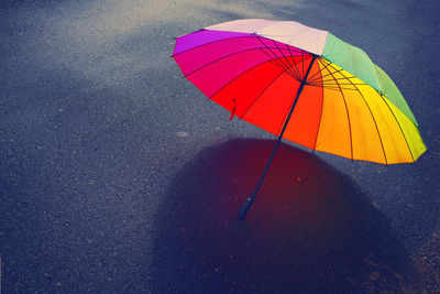 High angle view of umbrella on road