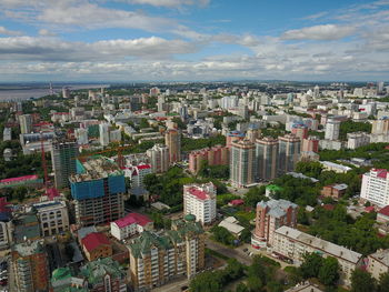 High angle view of buildings in city against sky