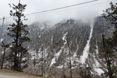 Scenic view of snow covered mountains against sky