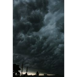 Low angle view of storm clouds at night