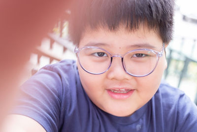 Close-up portrait of smiling boy