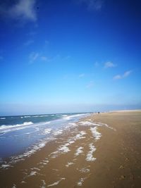 View of beach against blue sky