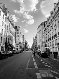 City street amidst buildings against sky