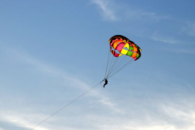 Low angle view of person on a parachute ride