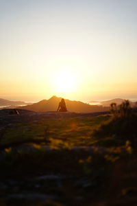 Scenic view of landscape against sky during sunset