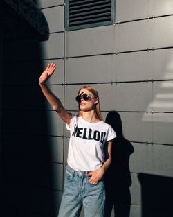 Man wearing sunglasses standing outdoors