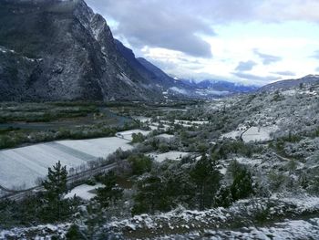 Scenic view of mountains against sky during winter