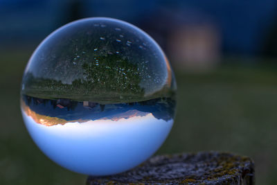 Close-up of crystal ball on glass