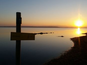 Scenic view of sea against clear sky during sunset