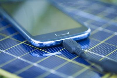 Close-up of mobile phone on table