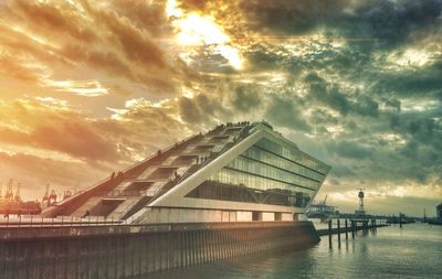 View of buildings against cloudy sky