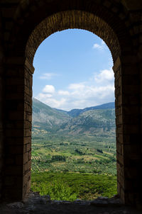 Scenic view of mountains against cloudy sky
