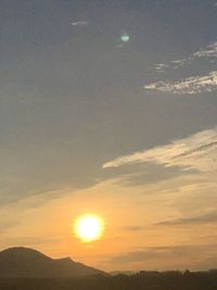 Scenic view of silhouette mountain against sky during sunset