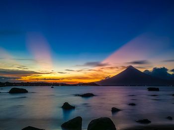 Scenic view of sea against sky at sunset