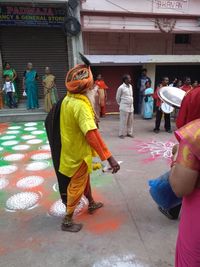 Rear view of people in traditional clothing