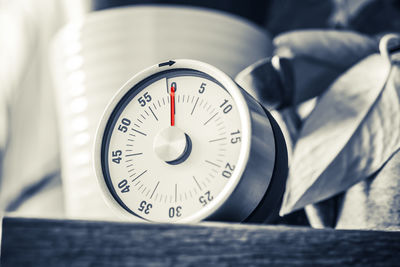 Close-up of timer on table