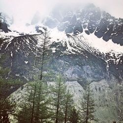 Scenic view of mountains against sky during winter