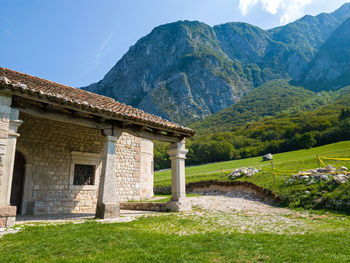 Built structure on mountain against sky