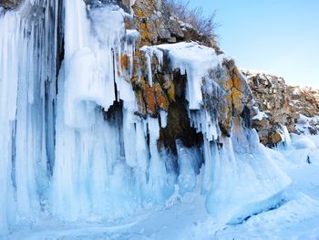 Panoramic view of frozen waterfall