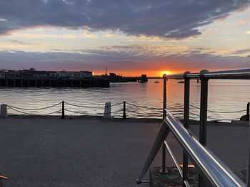 Scenic view of river against sky during sunset