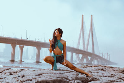 Full length of woman on bridge against sky