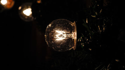 Close-up of illuminated light bulb