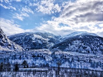 Scenic view of snowcapped mountains against sky