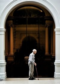 Rear view of a woman standing in balcony