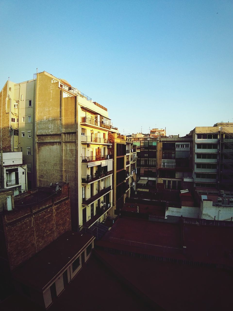 RESIDENTIAL BUILDINGS AGAINST CLEAR BLUE SKY