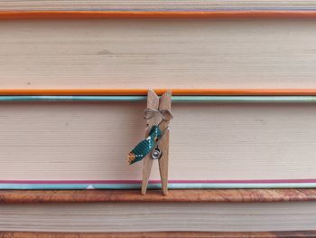 Close-up of clothespin against book