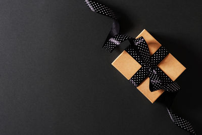 High angle view of pen on paper against black background