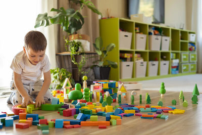 Boy playing with toy blocks