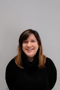 Portrait of a smiling young woman over white background