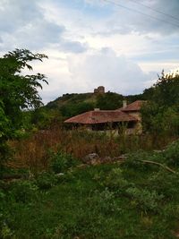 House on field against sky