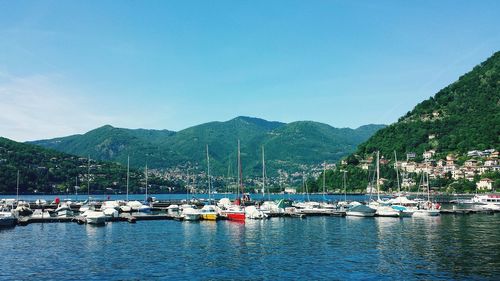 Boats moored at harbor