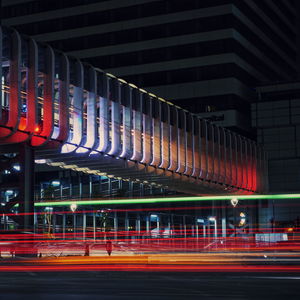 Light trails on road in city at night