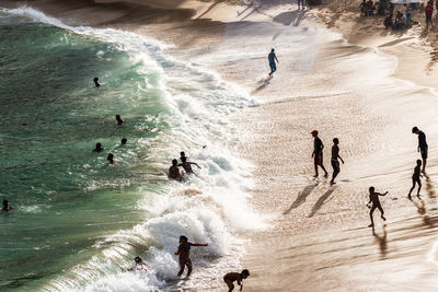 Large group of people on paciencia beach in the rio vermelho neighborhood of salvador, brazil. 