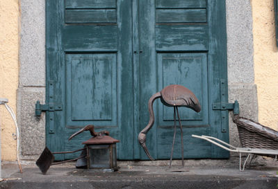 Sculpture of bird by door